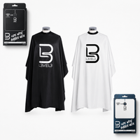 Capas de corte profesionales con cuello de caucho L3VEL3 en color blanco y negro con caja