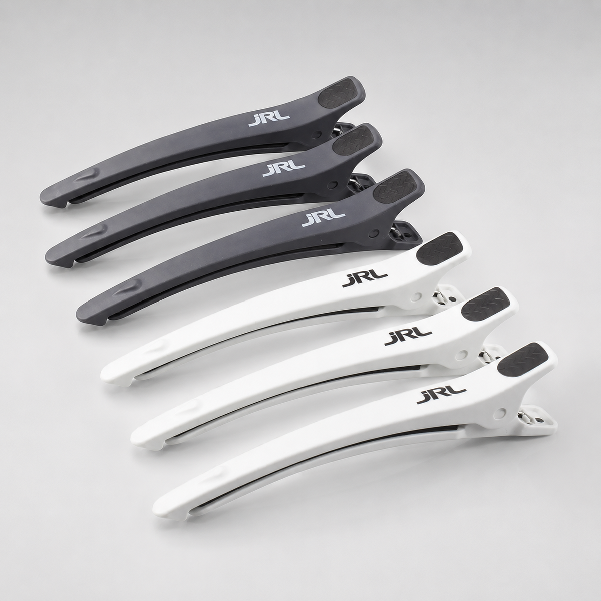 Pack de 6 pinzas profesionales de seccionado para peluquería y barbería JRL en color blanco y negro