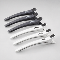 Pack de 6 pinzas profesionales de seccionado para peluquería y barbería JRL en color blanco y negro