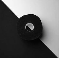 Detalle de rollo de tiras protectoras desechables para cuello de barbería y peluquería